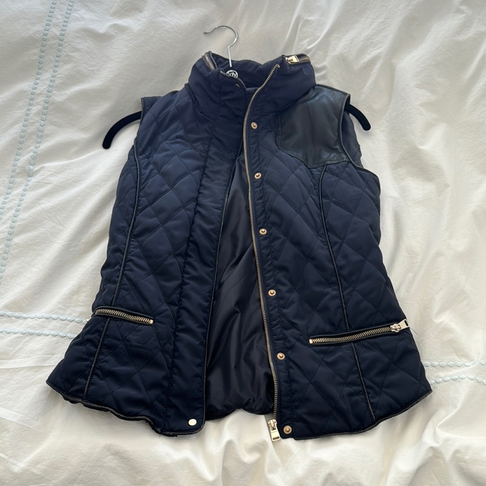 Stylish Black Quilted Vest with Gold Accents